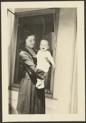 Woman Holding Smiling Baby