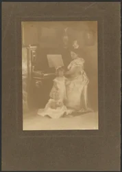 Woman at a Piano with Children