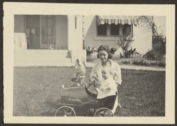 Woman with Children in Toy Car