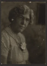 Woman with White Flower and Pearls