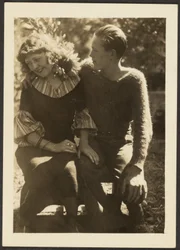 [Young Man and Woman Seated Outside]