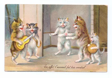 Edwardian postcard of a cat playing a guitar with three other cats and a kitten, c.1910