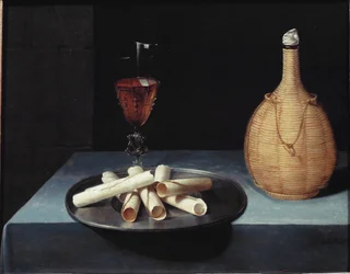 The still life wafer dessert of biscuits, wine bottle and glass