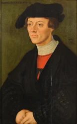 Portrait of a 19-year-old young man in black clothes