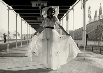 Model in a full summer dress created by the couture house Graldi
