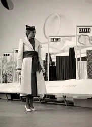 Model in an overcoat created by the couture house "Lamma"