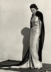 Model in evening dress created by the Italian couture house "Dragoni"
