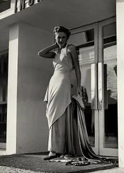 Model in evening dress created by the couture house "Graldi"