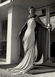 Model in evening dress created by the couture house Graldi