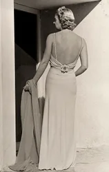 Model seen from the back wears evening dress from the couture house 