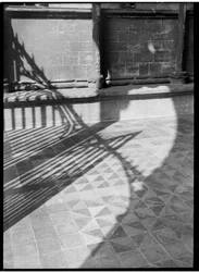Detail showing shadows cast over the floor tiles at the entrance to the cathedral church