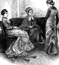 Three women sit in conversation