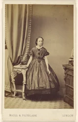 Unidentified woman, standing
