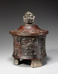 A Mayan lidded and carved tripod vessel, c.250-450