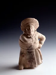Pre-Columbian art, Maya civilization, Classic period: anthropomorphic clay statuette representing a ball player, with the function of a musical instrument. From San Agustín Acasaguastlán, El Progreso, Guatemala. Dimensions: 19 x 8.5 cm. Guatemala