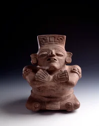 Pre-Columbian Art, Mayan Civilization, Classical Period: Anthropomorphic Clay Vase Depicting a Seated Character, Legs and Arms Crossed, Face Turned Upwards. From La Lagunita, Quiche, Guatemala. Guatemala, Museo Nazionale di Archeologia