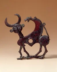 Bronze Jaw Plate Depicting an Androcephalous Monster Trampling a Doe. From Luristan. 750 BC. Paris, Louvre Museum