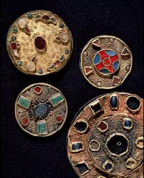 Archaeology of the Middle Ages. Barbarian art of Gaul: fibulae, from Latin fibula meaning attachment, in gold and silver filigree work, polychrome style. France, Merovingian period, 6th-7th century. Strasbourg, Archaeological Museum of the Palais R