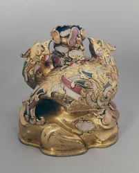 Chinese gilt copper wine vessel in the form of phoenixes on a rock