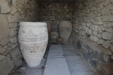 Minoan archaeological site of Phaistos. The magazine of the giant pithoi (storage jars). These jars are decorated with disc and rope patterns in relief.