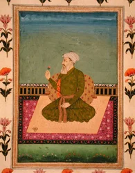A ruler seated on a carpet or terrace, holding a flower, from the Small Clive Album