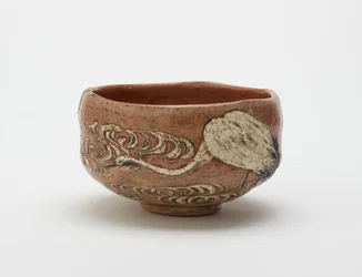 Kenzan style tea bowl with design of crane and flowing water, late 19th century