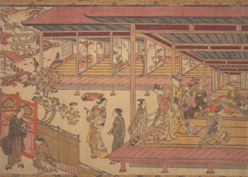 A Man Standing Outside the Gate of a Large House