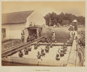 Beating a vat by hand