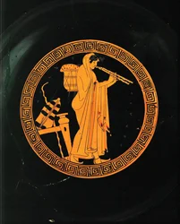 Aulete, a musician playing the aulos, a double flute