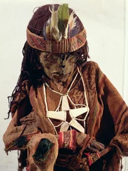 Mummy adorned with bone jewellery