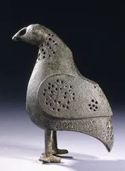 A Persian bronze incense burner in the form of a bird, 12th century