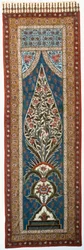 A glazed cotton kalimkari painted and printed with parrots and further birds perched in the branches of a flowering, flame-shaped tree