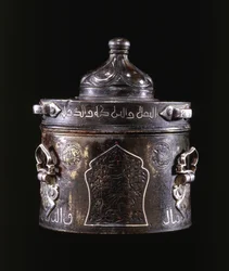 A very fine East Persian silver and copper inlaid bronze inkwell and cover