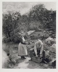 An Old Man and His Daughter Gardening