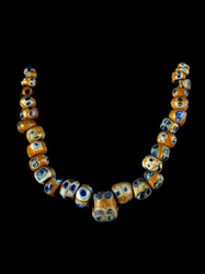 Phenician art: glass paste necklace. 4th-3rd century BC. Museo Archeologico di Villa Giulia, Rome