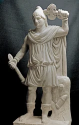Mithraic Divinity Holding a Torch and a Double Axe (2nd or 3rd century AD). Marble Sculpture. Louvre Museum, Paris