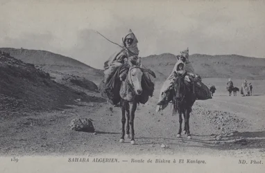 Travellers in the Algerian Sahara on the road from Biskra to El Kantara