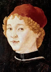 Portrait of a young man with a red hat