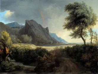 Mountainous landscape washed by the sea. Rainbow.