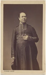 Unidentified Clergyman Standing, Holding a Hat