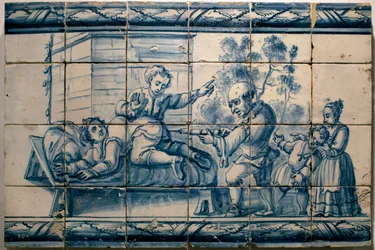 The doctor doing an enema to a patient - Satirical panel of Lisbon, first half 18th century - Musee national des azulejos, Lisbon (Portugal)