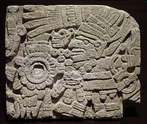 Sculpted Pectoral Representing a Richly Dressed Character