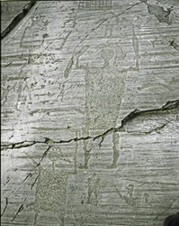 Prehistory, Camunni civilization, rock art: grave rock of stylized representations of warriors, (detail) depicting the Great Warrior armed with a sword and a shield. Period between the Neolithic and the Bronze Age. Roche n. 50. Naquane (Brescia)