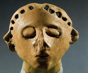 Head of clay statue. 3000 BC Neolithic, Stone Age. Historical Institute of Sciences of the Republic of Moldova, Chisinau