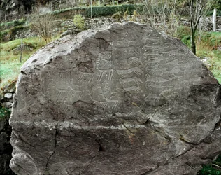 Prehistory, rock art: grave rock with representations of deer, cattle and daggers, Copper Age, Eneolithic period (Chalcolithic), rock no. 1, Cemmo (Brescia), Parco archeologico nazionale dei Massi di Cemmo, Italy