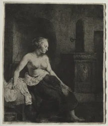 Woman Sitting Half Dressed Beside a Stove