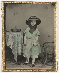 Portrait of a Girl Holding a Hoop by a Table