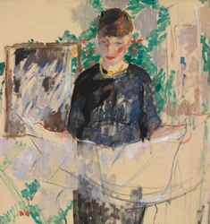 Woman in black reading the newspaper
