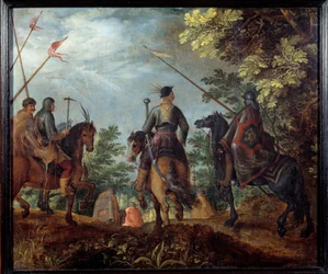 Polish horsemen walk in a wood