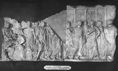 Haruspice consulting the entrails of a bull and a procession of senators outside the Temple of Jupiter